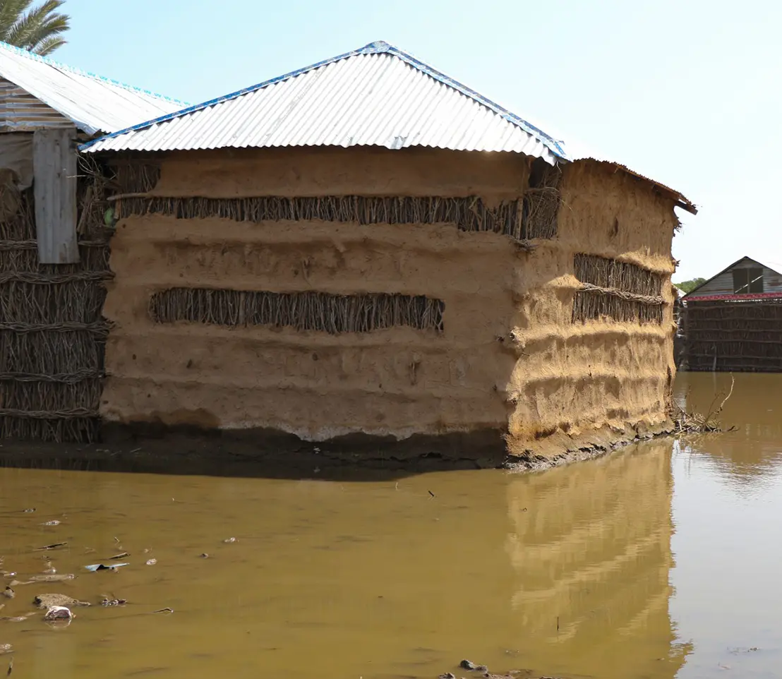 Kenyan house surrounded by flood water caused by climate change